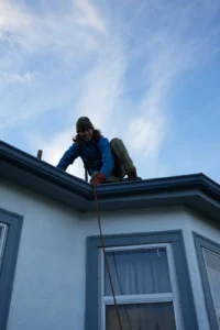 Professional roof and gutter cleaning to protect a home exterior