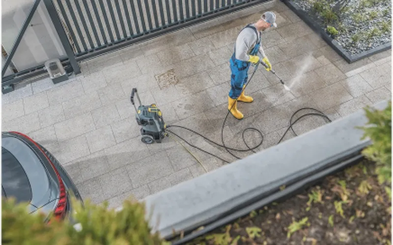 Pressure washing sidewalks at an apartment community in Kitsap