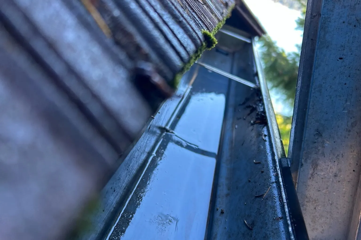 After professional gutter cleaning showing clean gutters