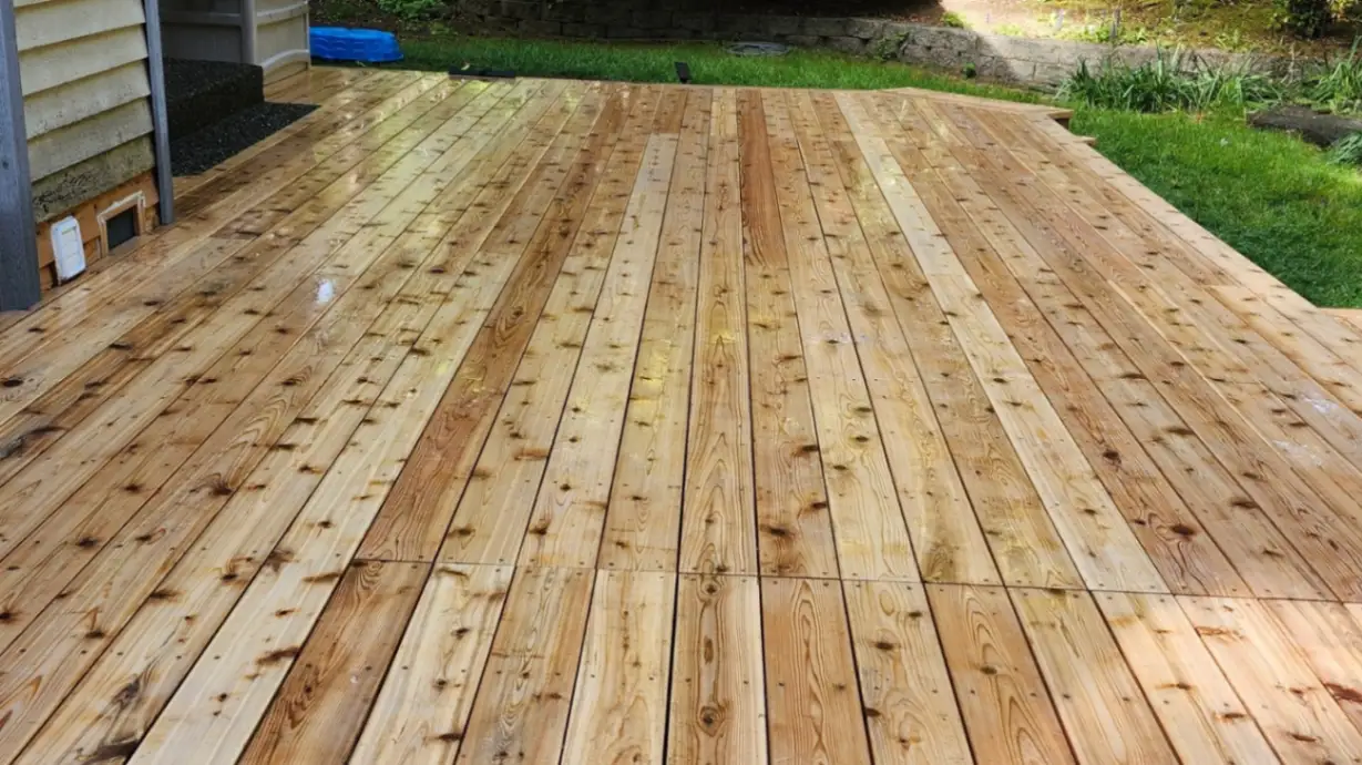 Clean wooden deck after professional pressure washing service