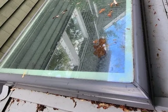 Before window cleaning showing dirty glass with streaks and exterior buildup
